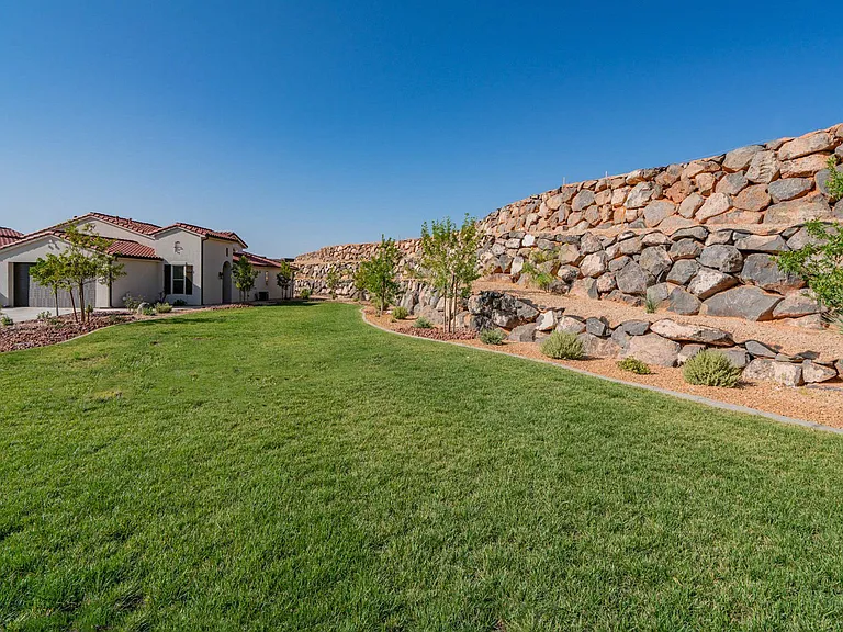 Adjacent lawn is cared for by the HOA, all the benefits of having a lawn with no yard care responsibilities!