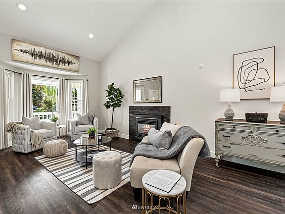 Beautiful bay window, modern laminate flooring and new fireplace surround