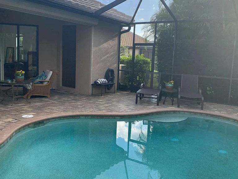 Saltwater Pool, Hottub, outdoor kitchen, outdoor lounge with big screen tv and remote hurricane screen closes to enclose outdoor lounge during rain.