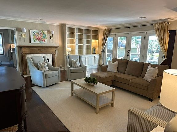 Den with French doors leading out to deck