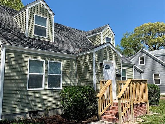 New driveway, front walk, and front porch. New vinyl siding as well.