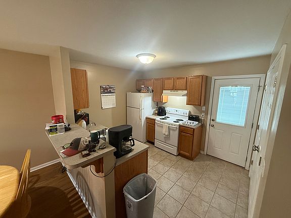 kitchen with washer and dryer closet to the right of the of kitchen