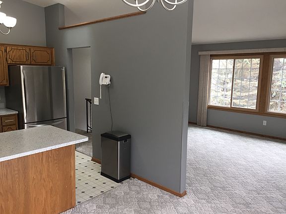 View from dining room into kitchen and living room