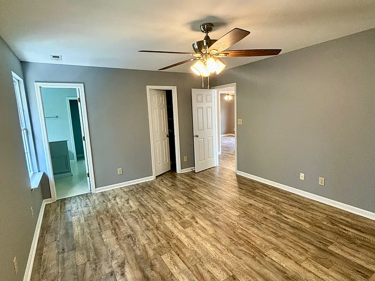 Owner suite with full bath, walk in closet. Ceiling fan. Both windows outfitted with privacy blinds and valences after pic was taken.