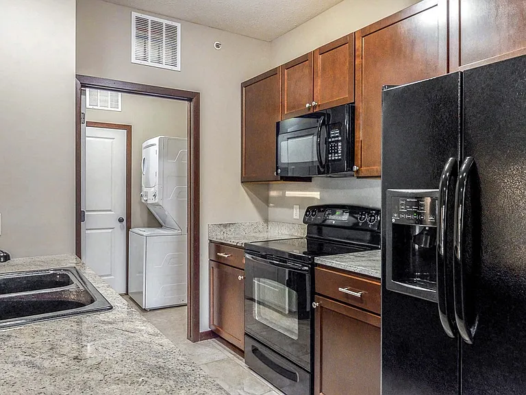 Sleek appliances and plenty of cabinet storage adorn our kitchens.