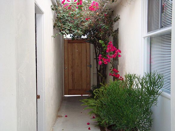 View of the courtyard. Detached garage door entry on left