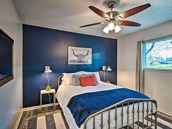 Master bedroom with navy blue & gold accents