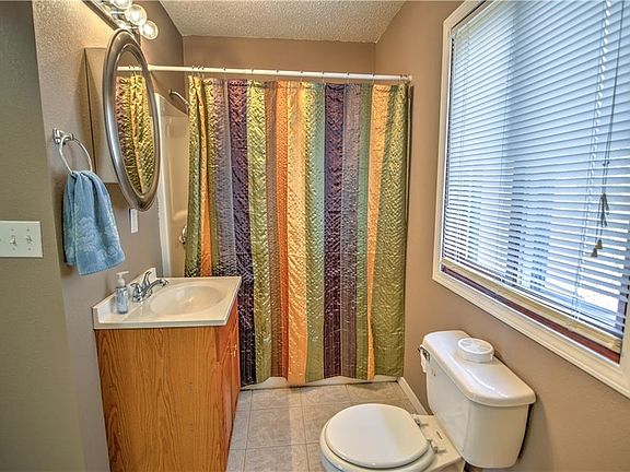 The main floor bathroom has a walk-in shower, and hookups for a washer and dryer.