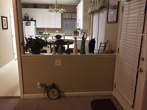 Fenced in Backyard with deck....door off the den to deck acc