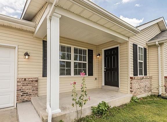Covered porch, new shutters and freshly painted door.