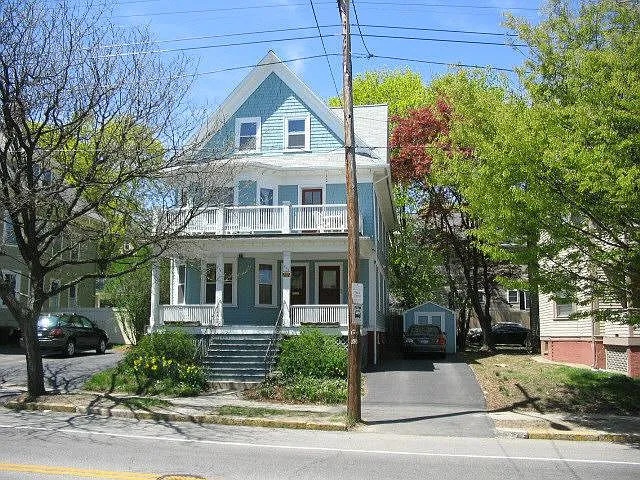 Front of house. Parking for 3 cars is on right. Shed is shared.