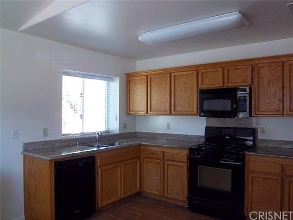 Granite Counters in Spacious Kitchen