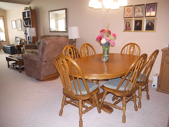Dining room view into living room
						:
						Can accommodate expanding table to serve 8 plus buffet and side serving cabinet