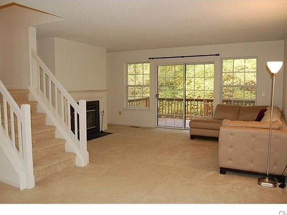 Living Room with Wood Burning Fireplace and Private Deck