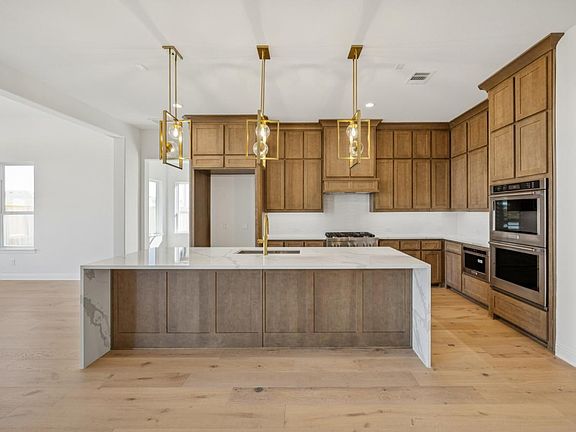 Spacious kitchen with ample cabinet and countertop space