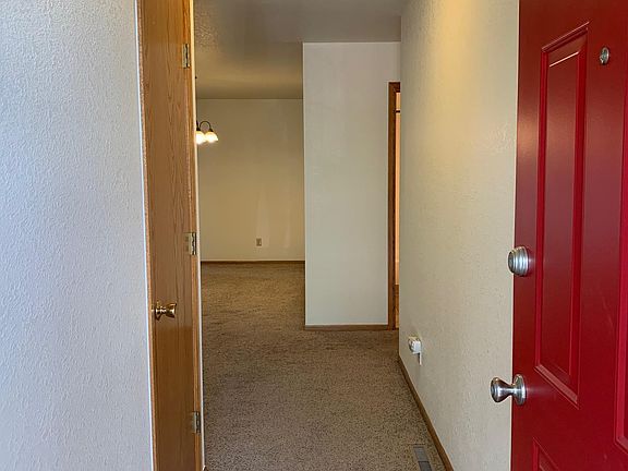 View from just inside the front door to the hallway leading into the living area.