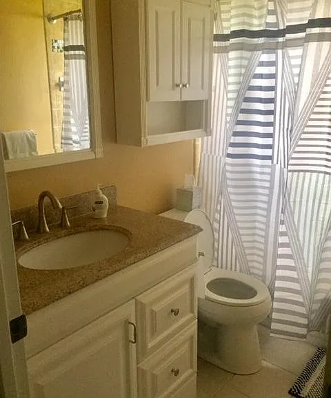 Full bath located near Bedrooms Number Two and Three.