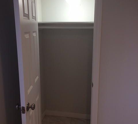 Bedroom closet with plenty of lighting