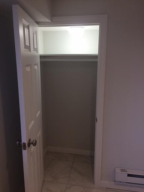 Bedroom closet with plenty of lighting