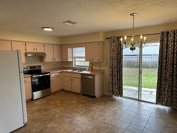 Kitchen/Dining room and back sliding glass door