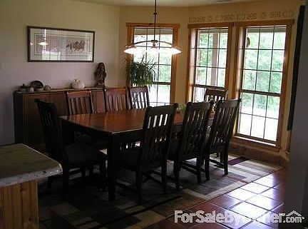 dining room
						:
						four huge windows look out onto five acres of trees and let in natural light