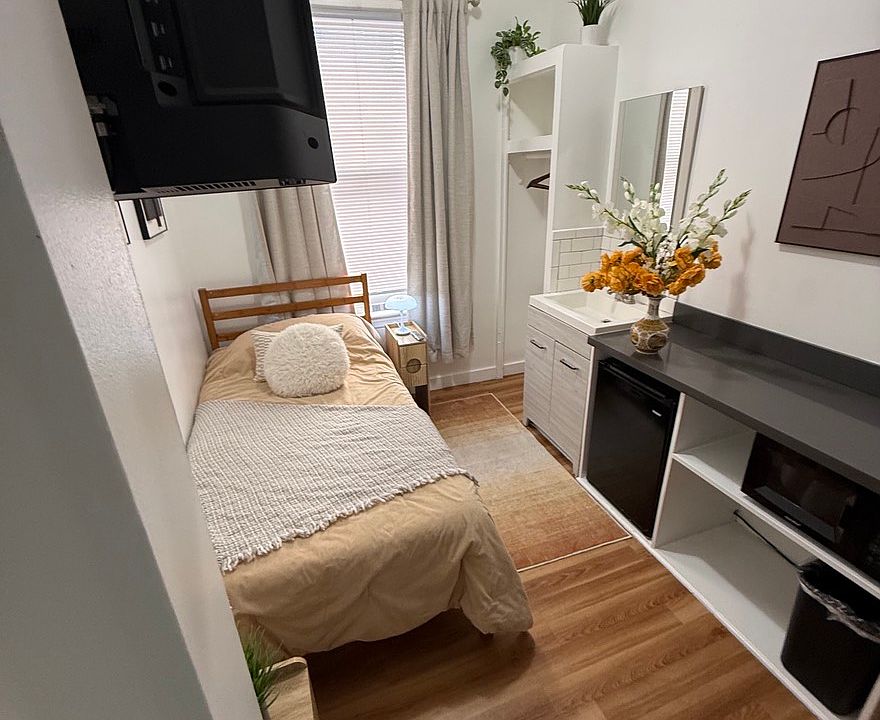 Spacious private room with bed, TV, and storage Unit