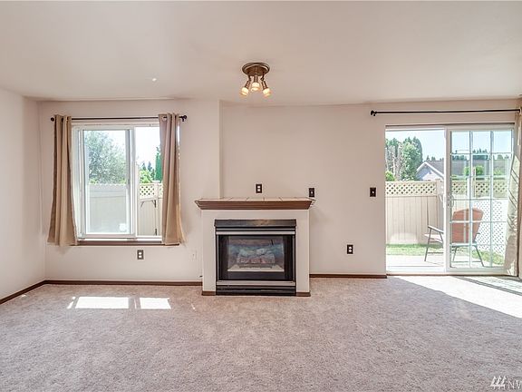 Living room has gas fireplace
