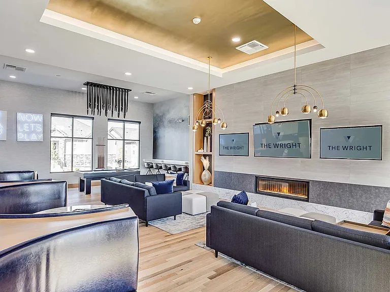 Enjoy an upscale resident experience with designer seating, fireplace ambiance, entertainment screens, private booths, and integrated social spaces built for gathering and relaxation.