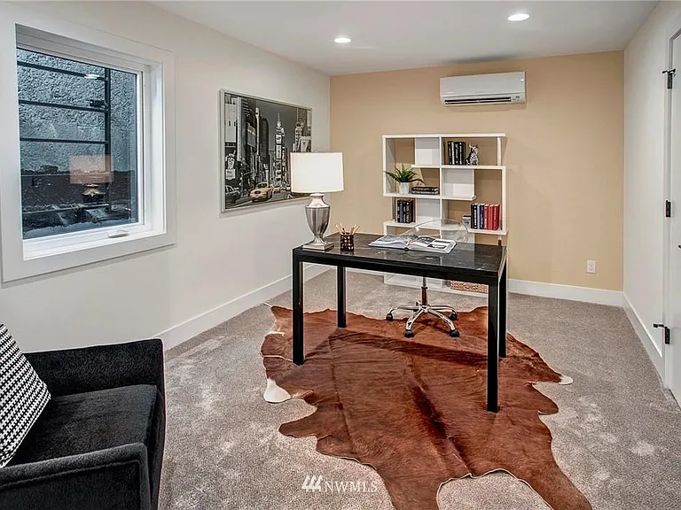 The lower level offers two bedrooms, each with its own custom-organized closet.