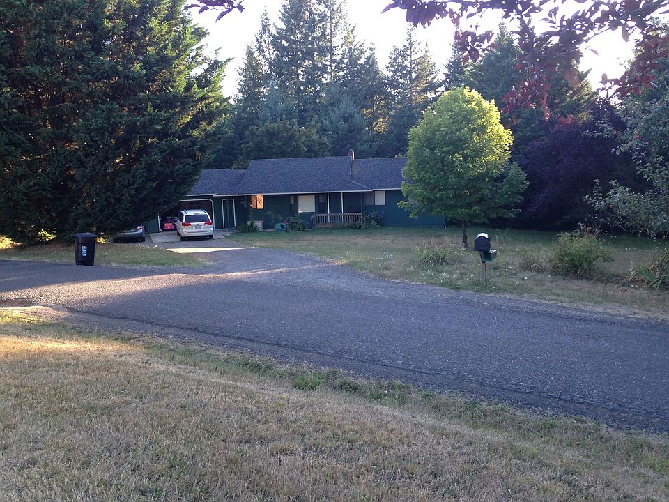 Front of house with large driveway
