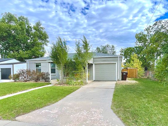 Front of house w/ privacy treed porch.