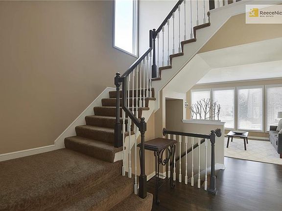2 sty entry w/ new light fixture.