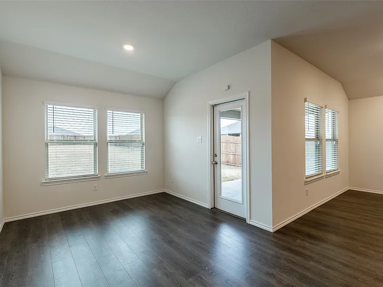 The breakfast area has a great view of the extra large backyard and the covered patio.