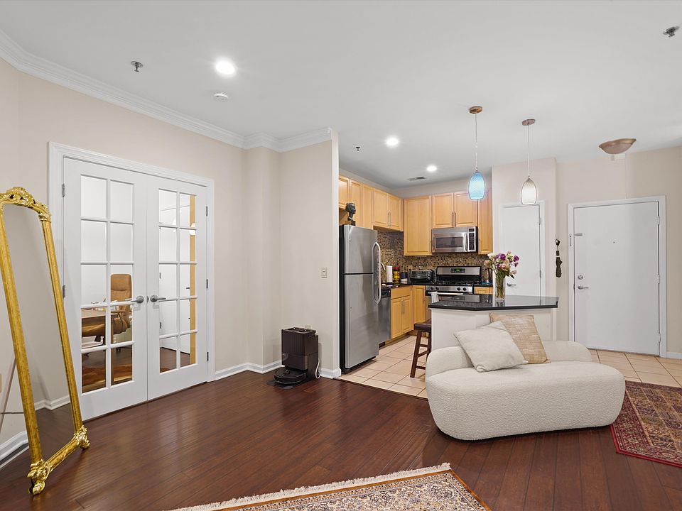 Spacious living area with adjoining bonus room_perfect as a home office, conference room, or guest bedroom.