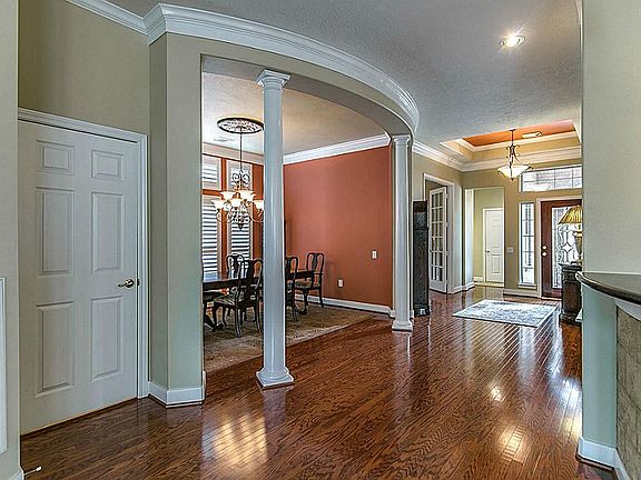 From the Foyer to the Study and the Dinning Room the beautiful hardwood floors continue. The door shown leads to the powder bathroom for your guests.