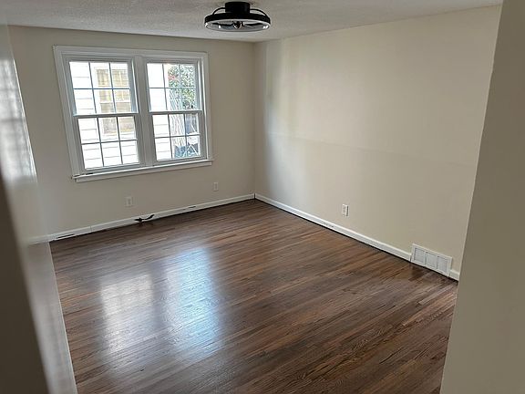 Spacious master bedroom with newly refinished wood floors and closet!