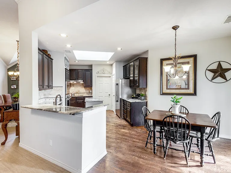 View from living room to the kitchen. Spacious breakfast area.