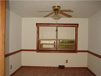 Dining Room with Chair Rail and Ceiling Fan!