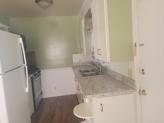 kitchen with new counter tops and new refrigerator