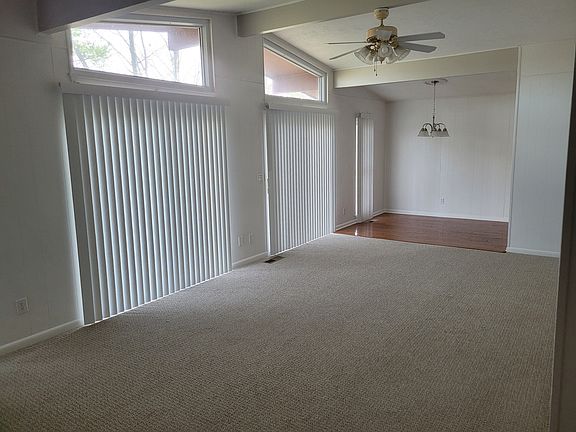 Living room ( 12' x 23.5' ) and dining area ( 8' x 9' ) from front entry.