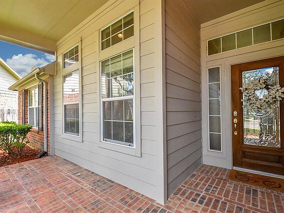 This front porch is perfect for reading a book and relaxing.