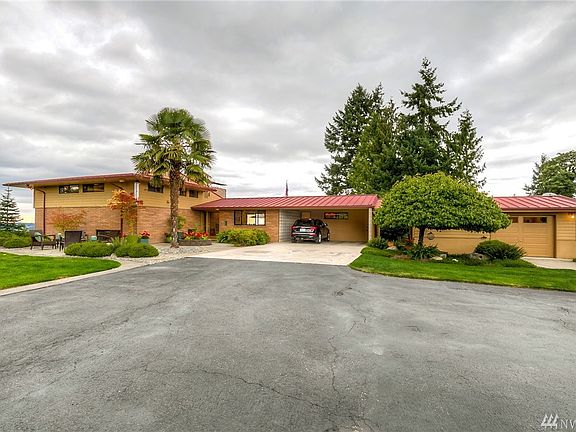 Through the privately gated entrance is this beautiful architecturally crafted home blending classic & contemporary styling.