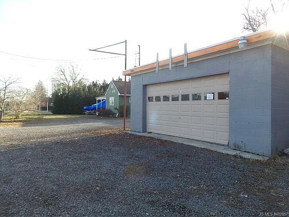 Detached garage is currently an income producing shop.