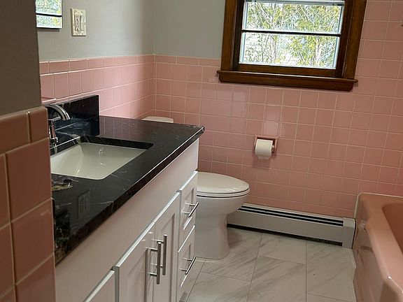 Freshly renovated bathroom featuring a brand-new sink and modern vanity, offering a clean, updated look with functional design and contemporary finishes.