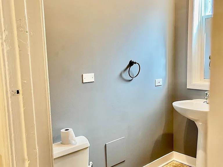 Bathroom featuring toilet and pedestal sink