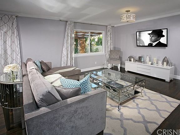 The expansive family room is drenched in natural l