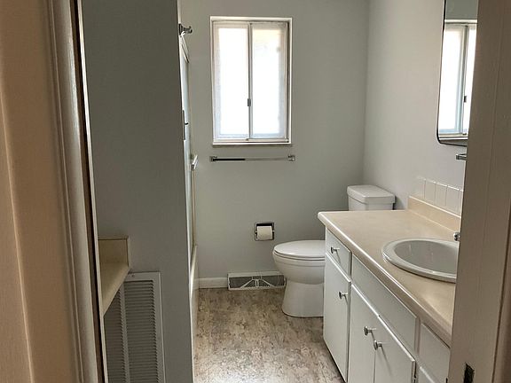 Full bathroom with shower & tub.