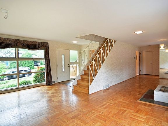 Gleaming parquet floors throughout