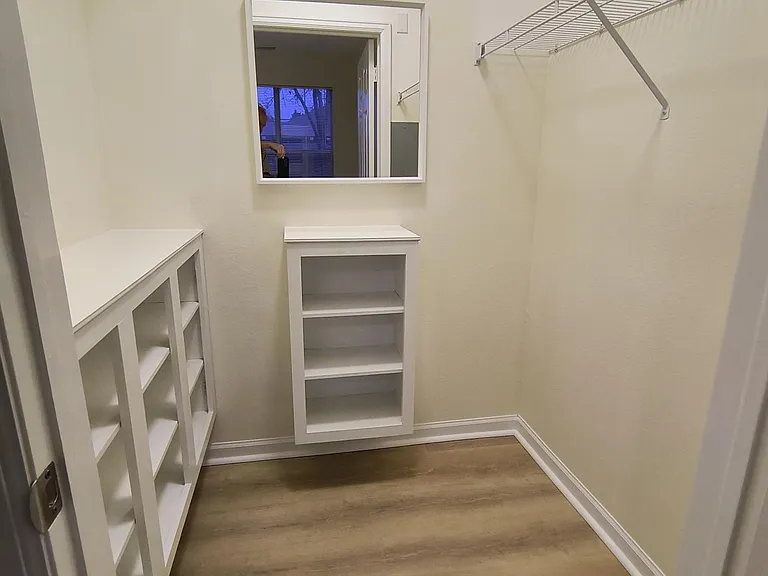 Large walk-in closet in primary bedroom.