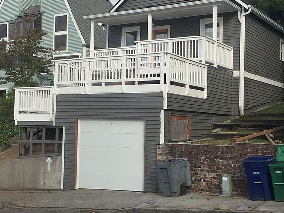 one car garage with no access to the house from the garage. Full, two story deck. upper is covered.